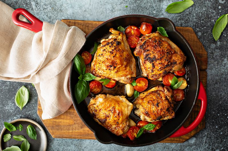 Roasted chicken thighs with tomatoes and garlic